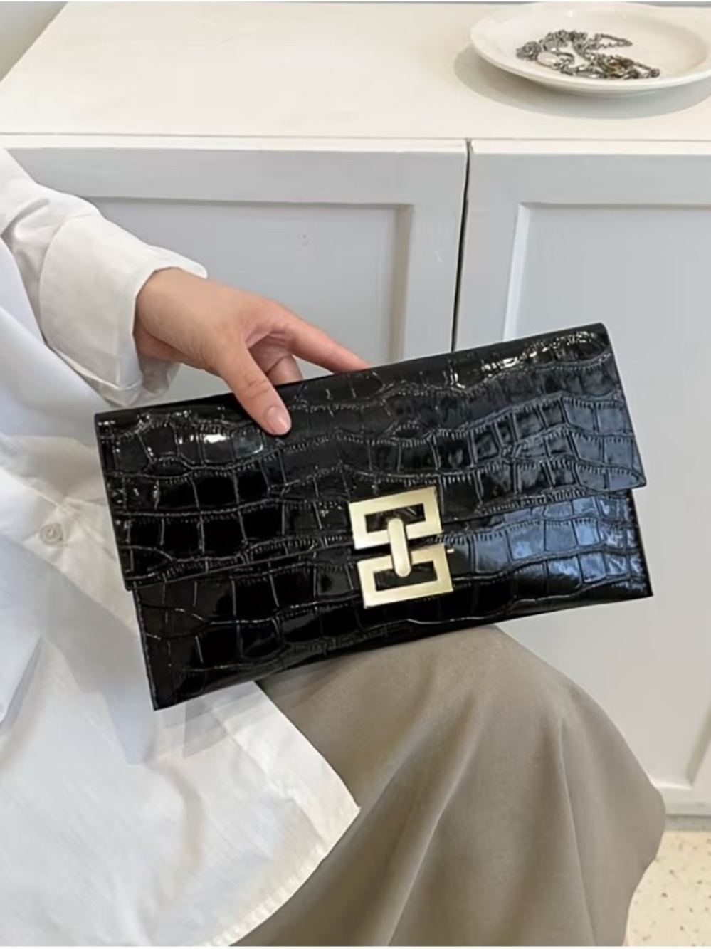 Black Croc-Embossed Patent Clutch with Gold Hardware
